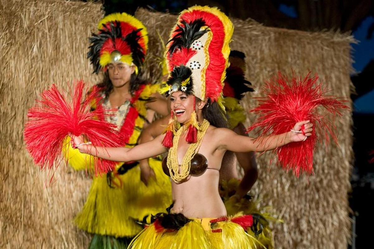 two women in costumes with feathers on a stage