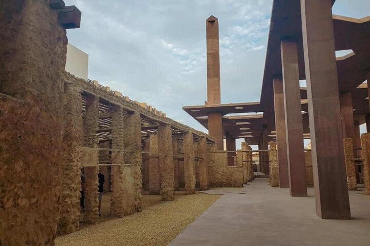 an old stone building with columns and a building