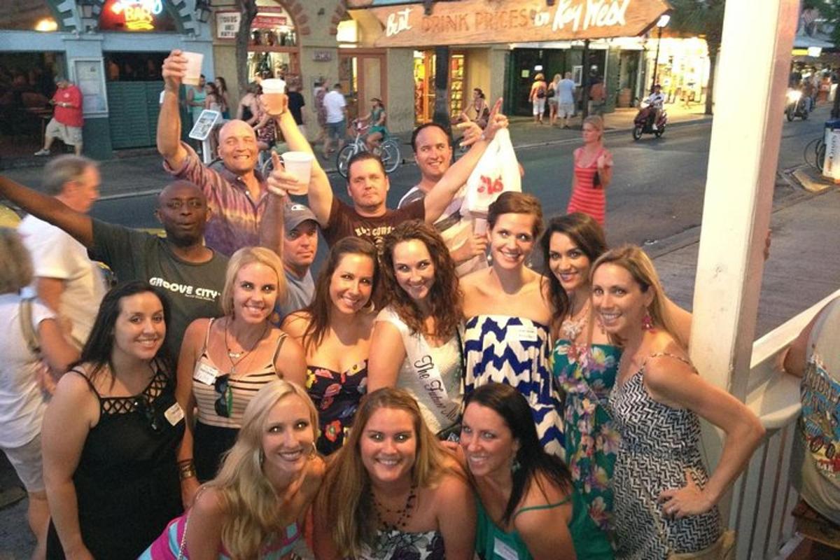 a group of people posing for a picture on a street
