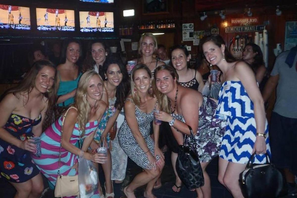 a group of women posing for a picture at a party