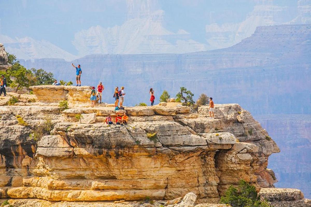 a group of people standing on top of a mountain
