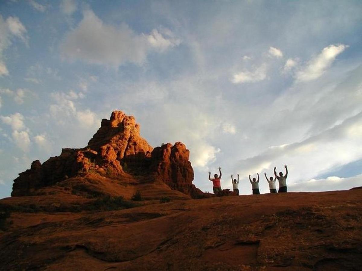 a group of people standing on top of a mountain