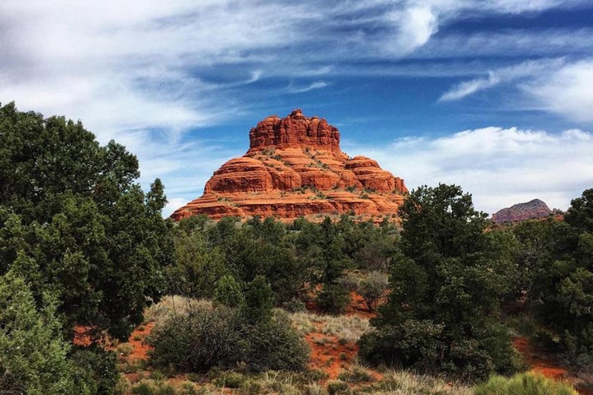 a large red rock formation in the desert