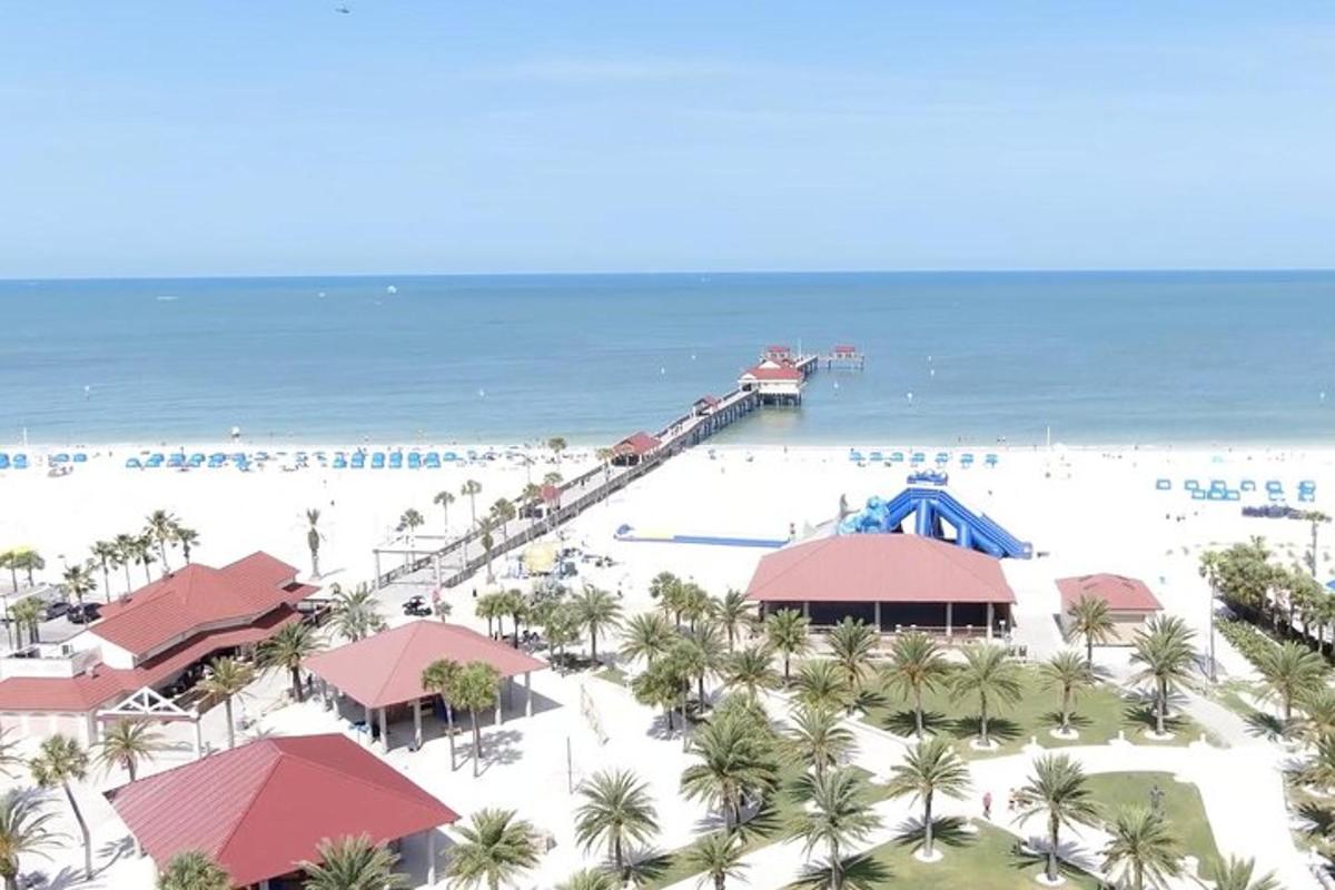 an aerial view of the beach at a resort