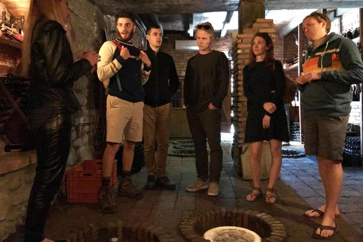 a group of people standing in front of a fireplace