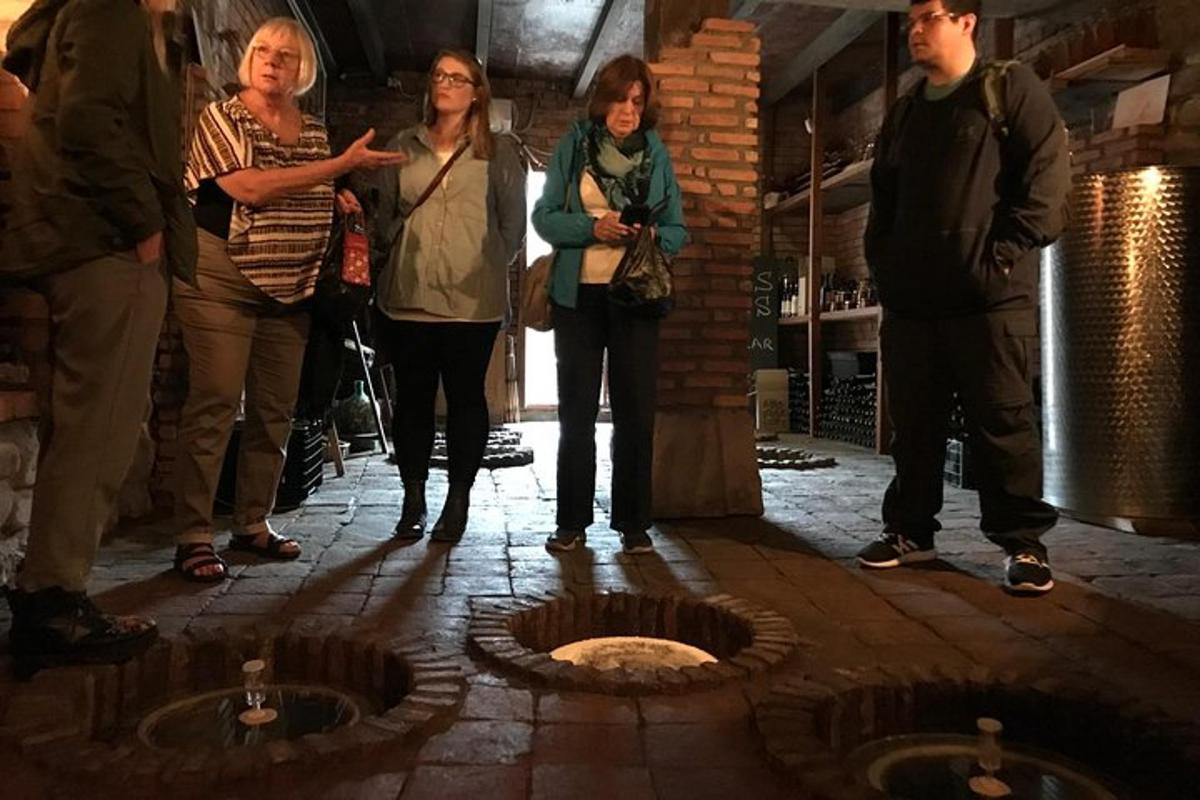 a group of people standing around a fire pit