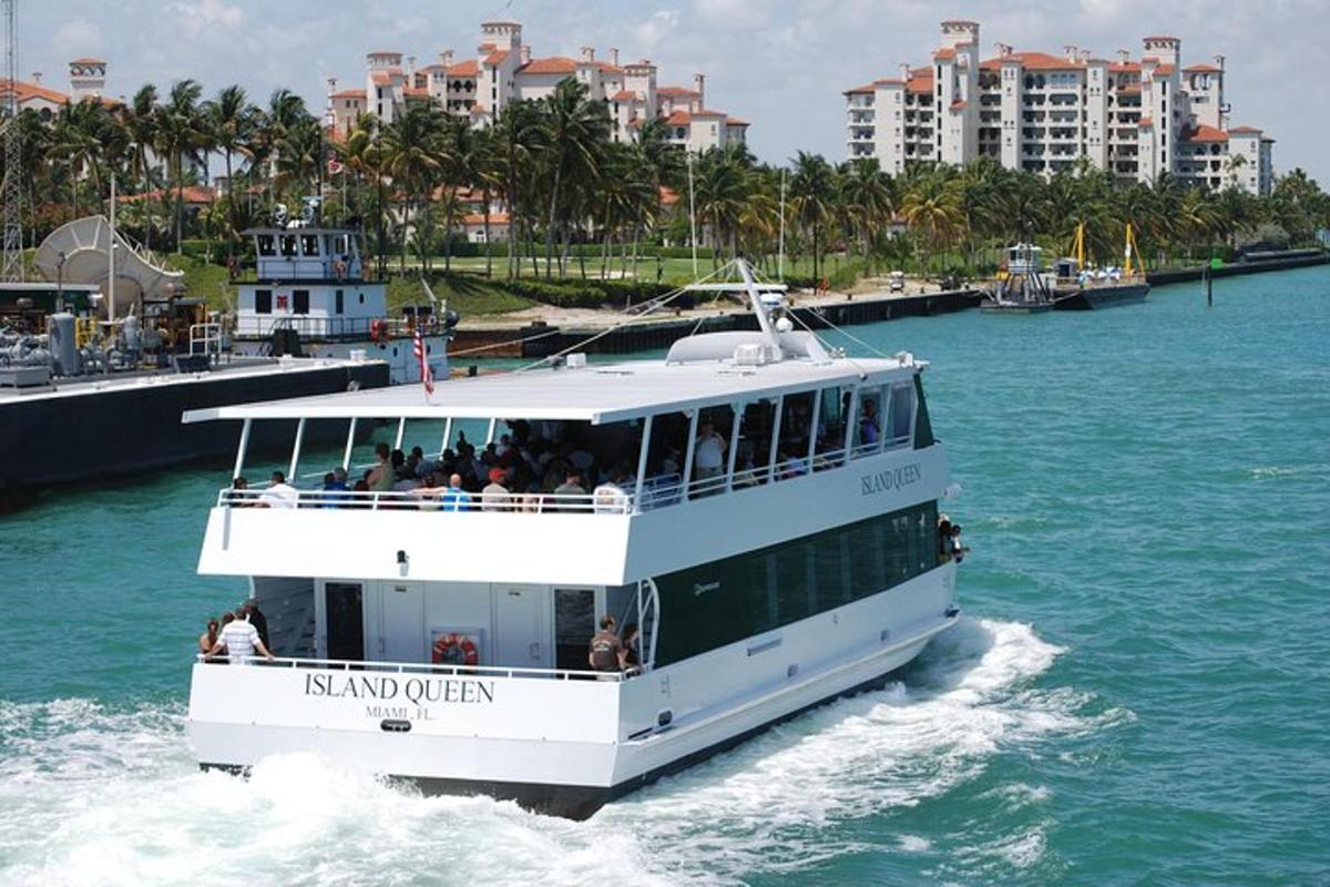 a ferry boat in the water with buildings in the background