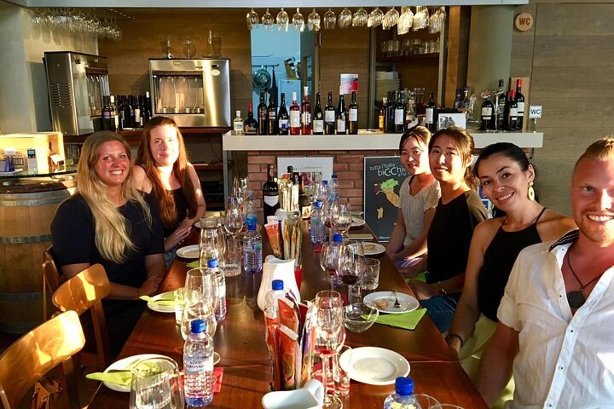 a group of people sitting at a table in a restaurant