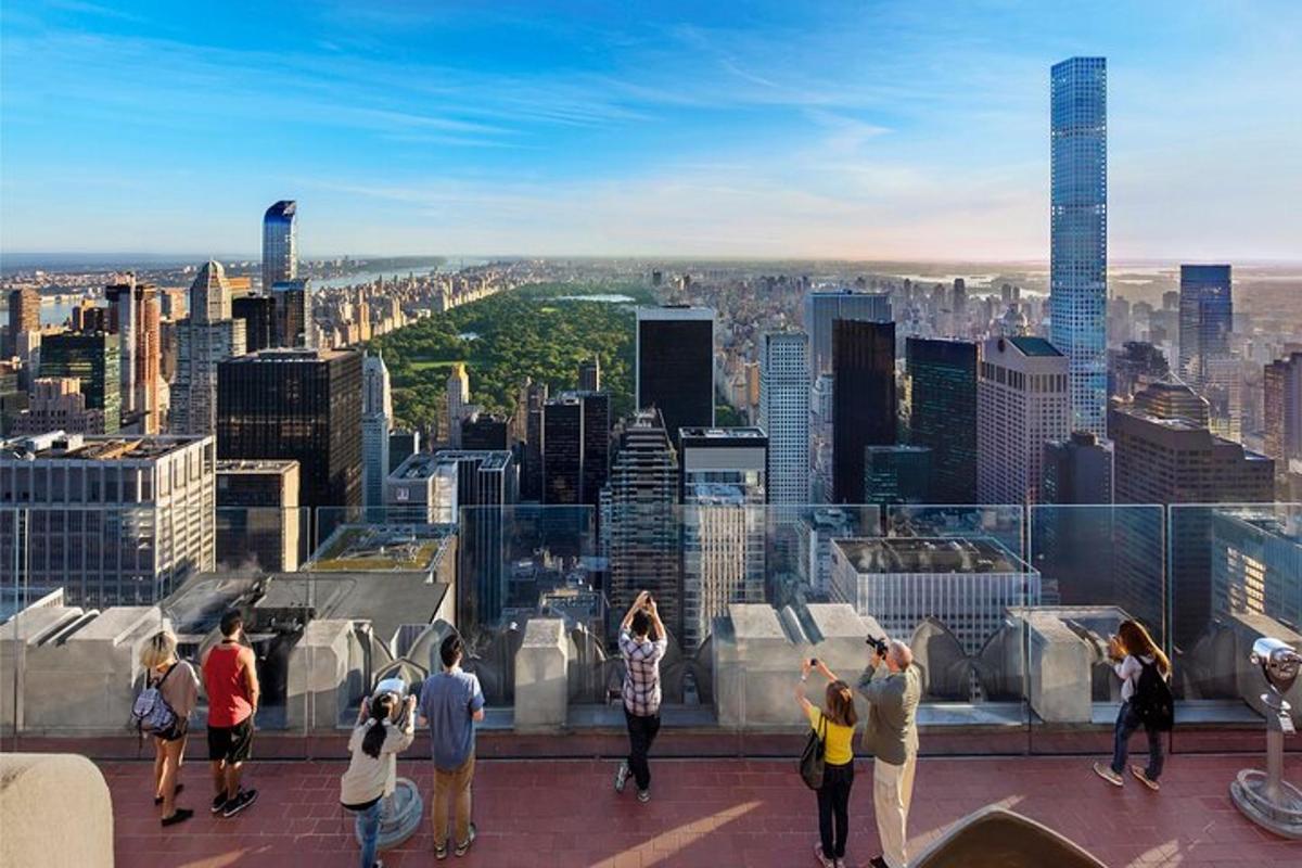 a group of people standing on top of a building