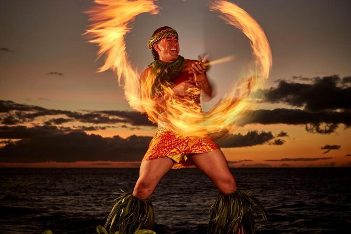 a man in a fire costume standing in the water