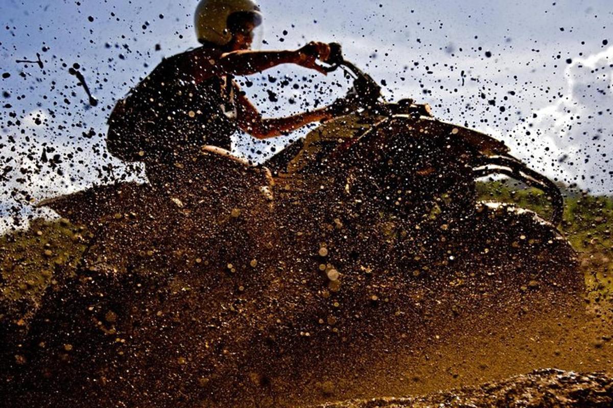 a man riding on the back of a dirt bike