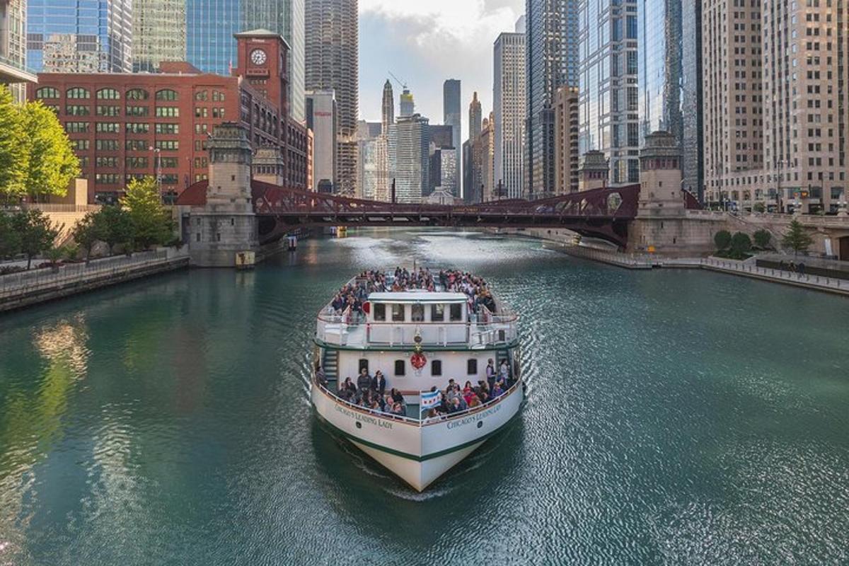 a boat filled with people on a river in a city