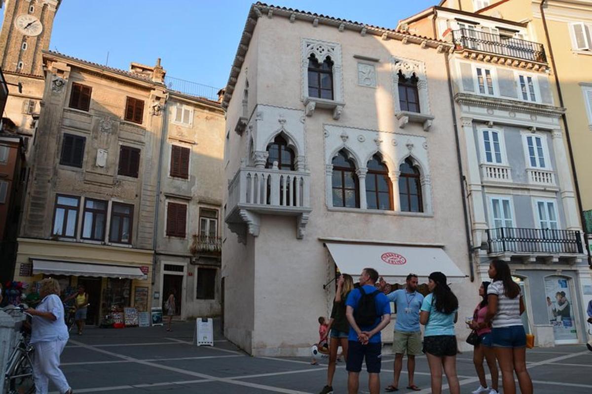 a group of people standing in front of a building