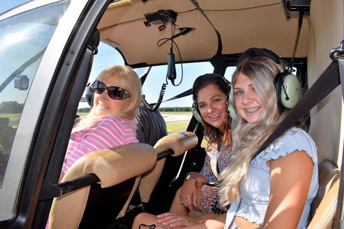 three women sitting in the back seat of an airplane