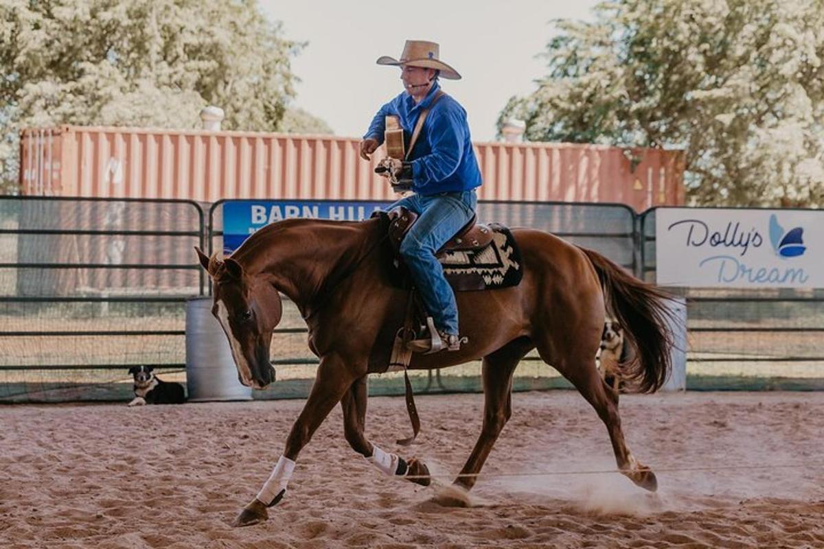 a man riding on the back of a brown horse