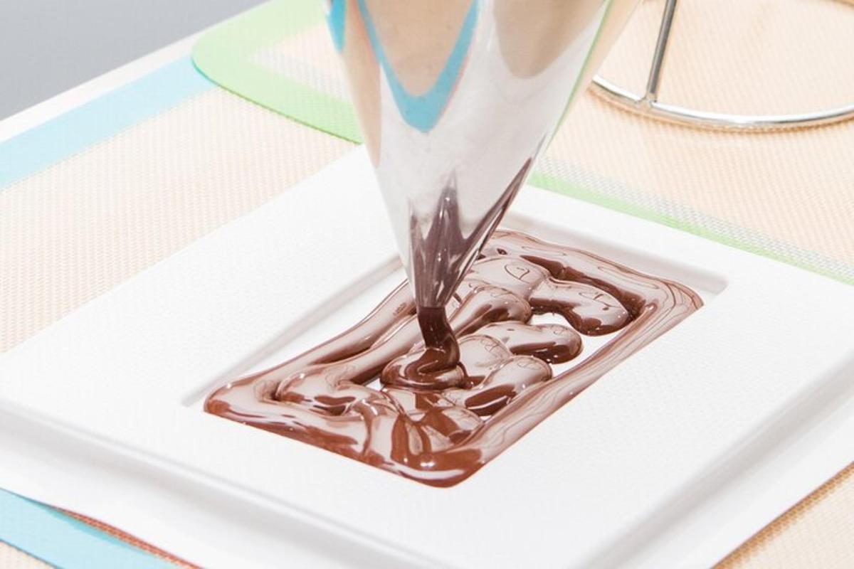 a container of chocolate on a white plate