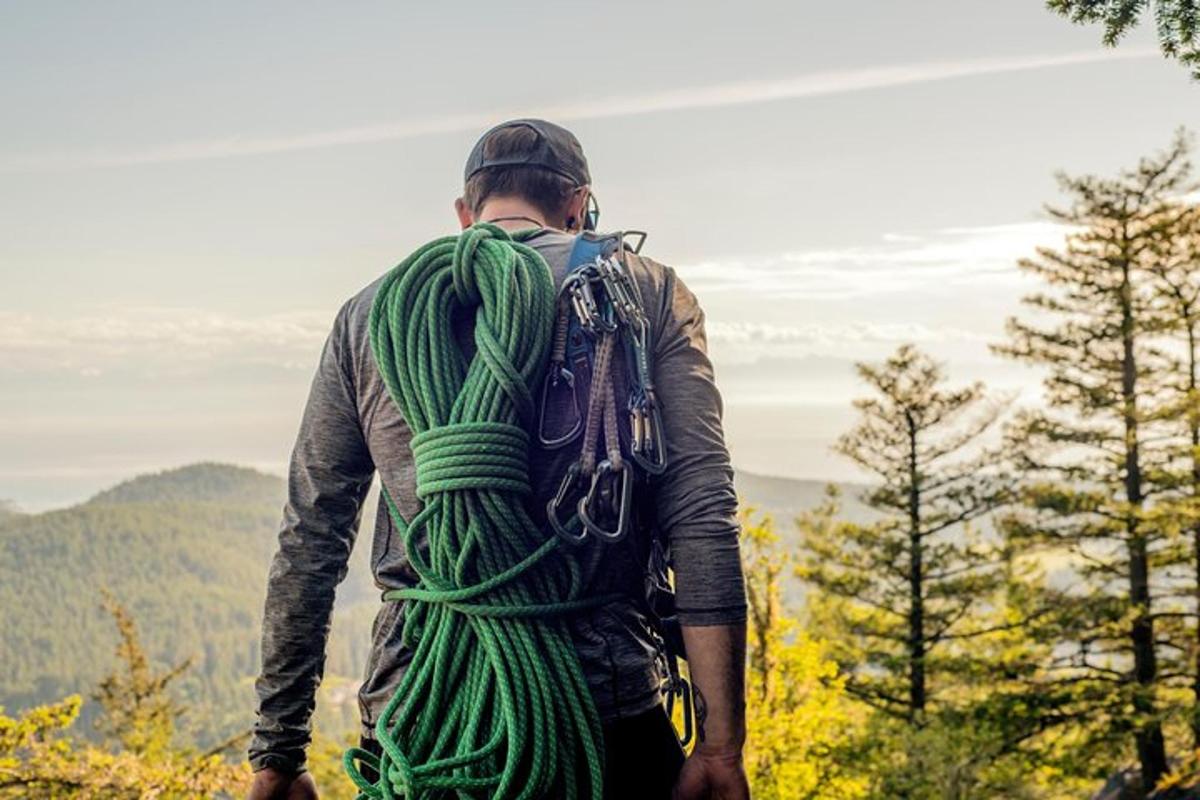 a man with a backpack standing on a mountain