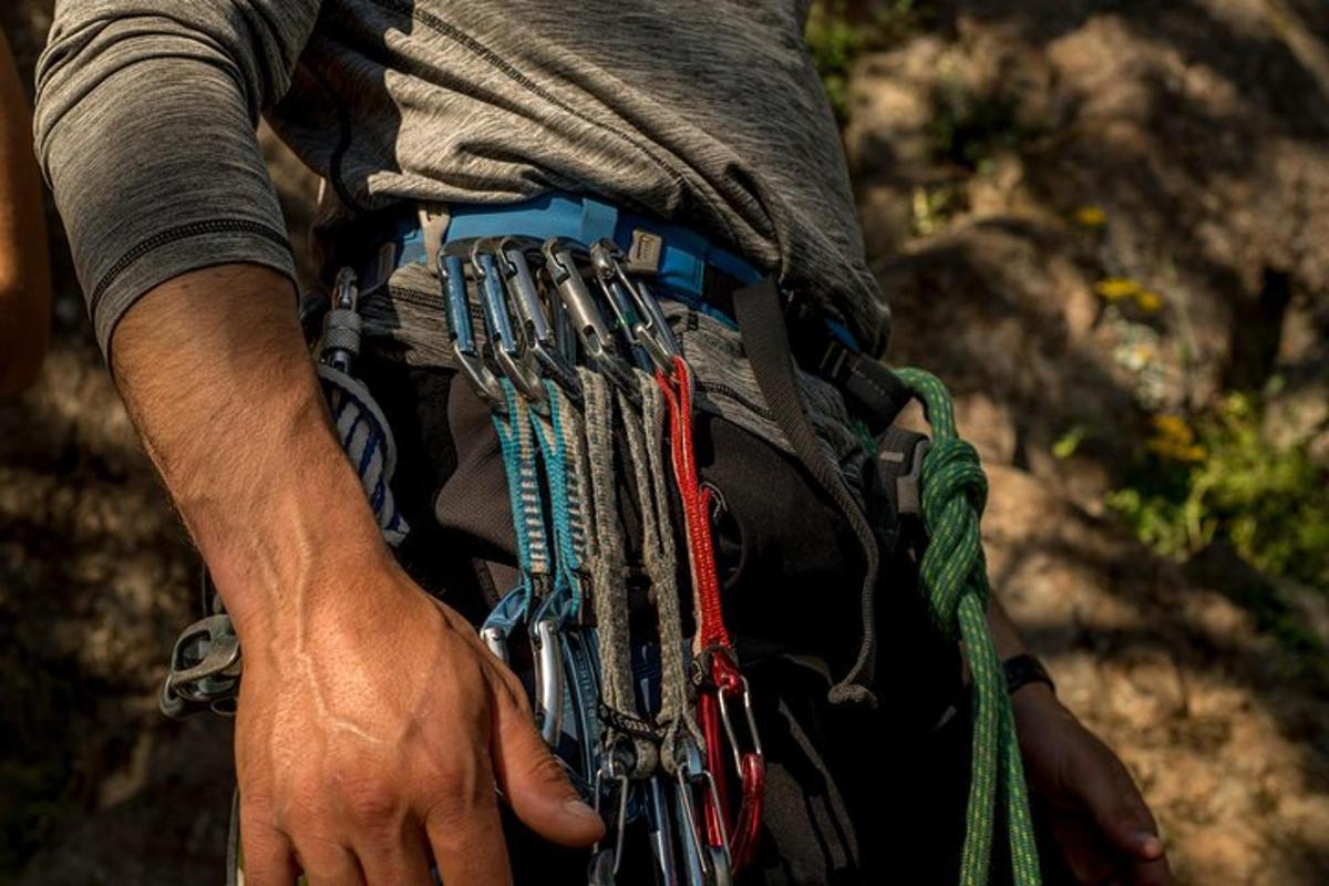 a person wearing a belt with a bunch of bracelets