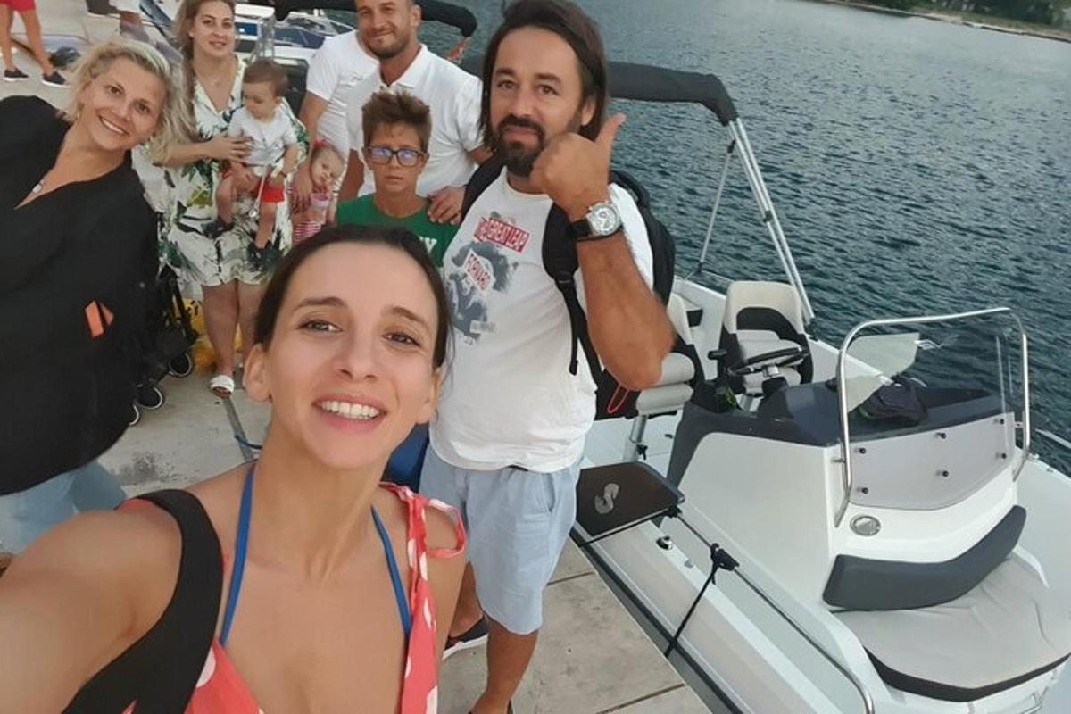 a group of people on a boat in the water
