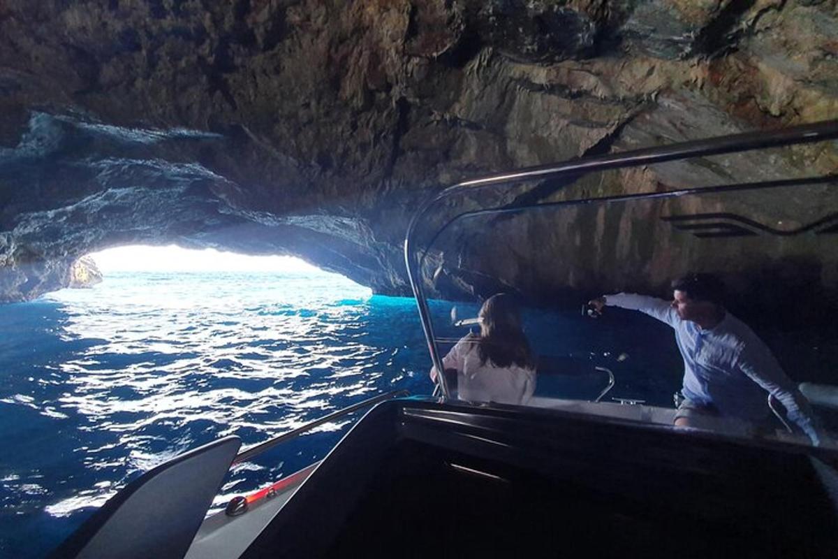 a man and a woman in a boat in a cave
