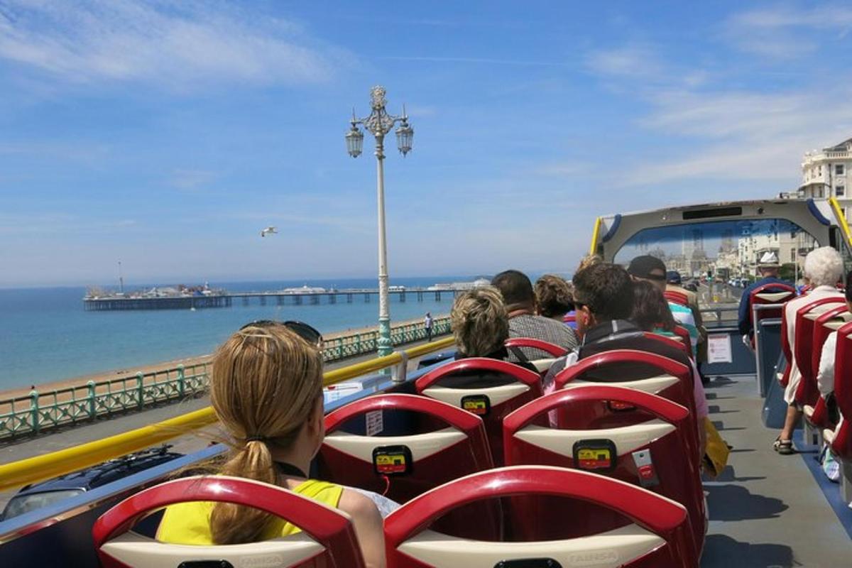 a group of people riding on a bus near the water