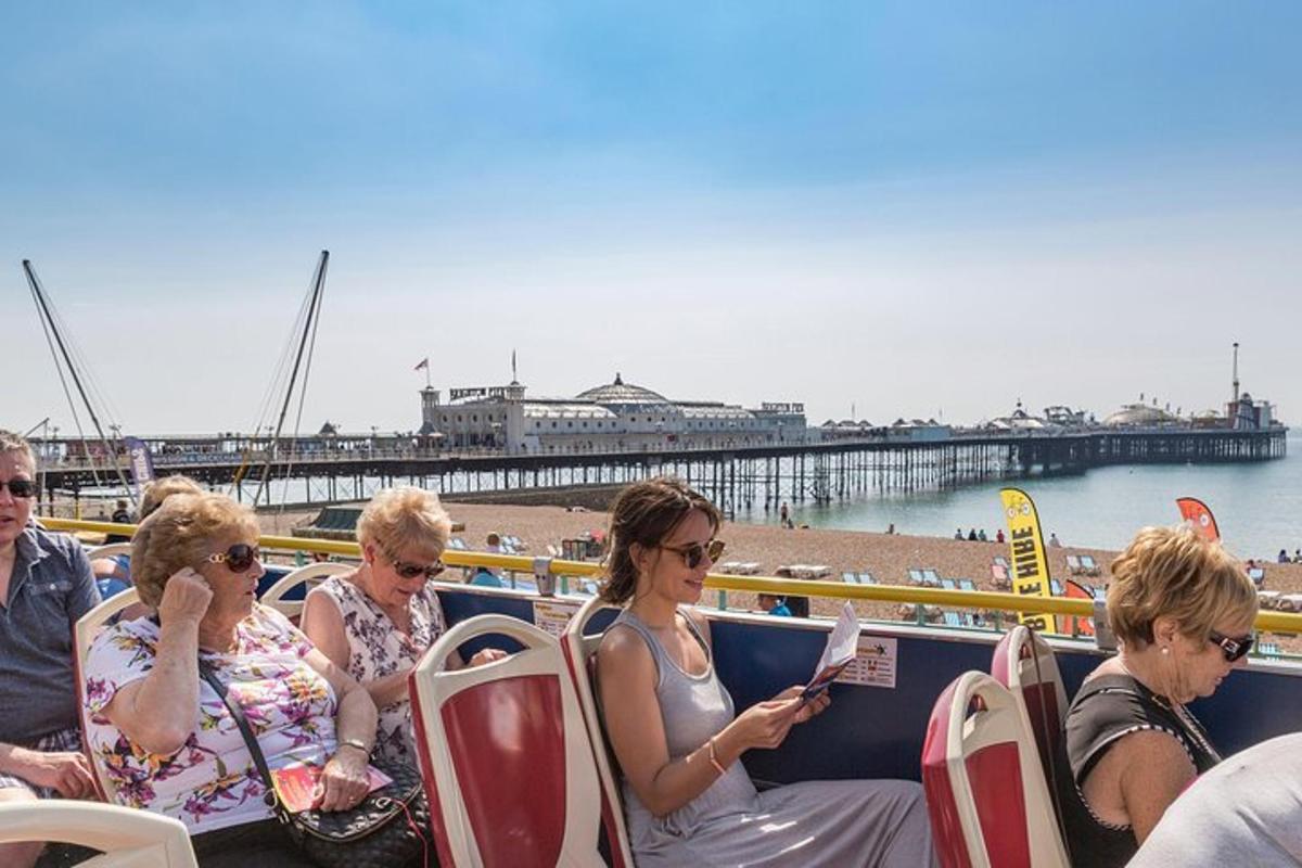 a group of women sitting on a boat near a pier