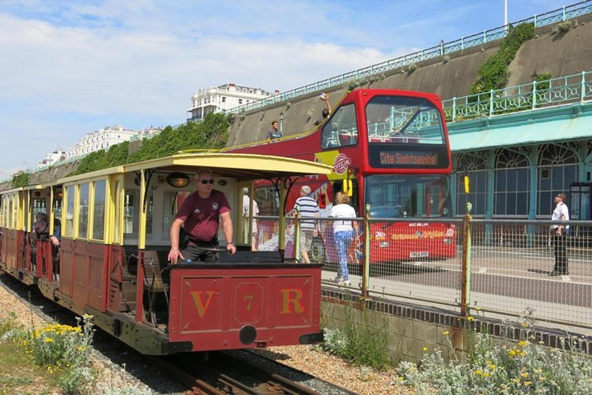a red and yellow train with a double decker