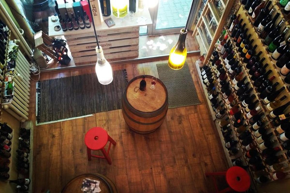an overhead view of a wine shop with a barrel and lights