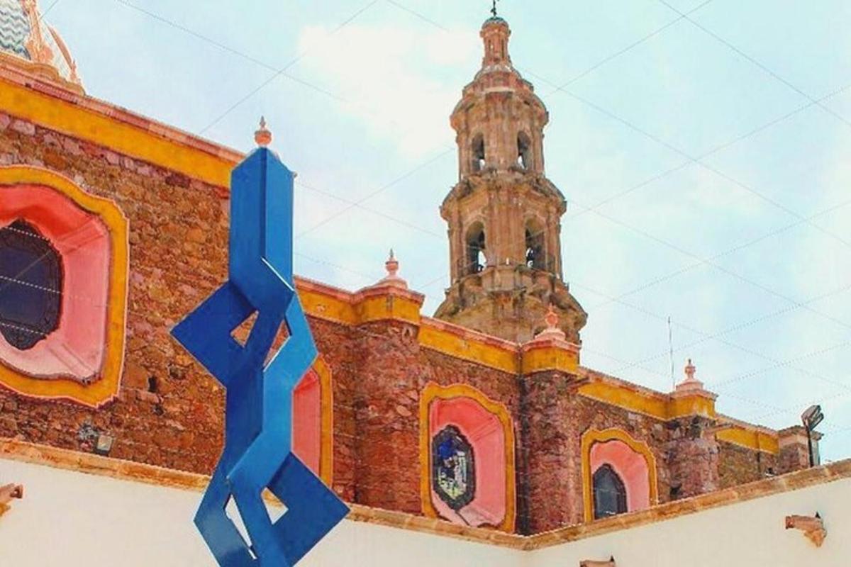 a building with a blue ribbon in front of it