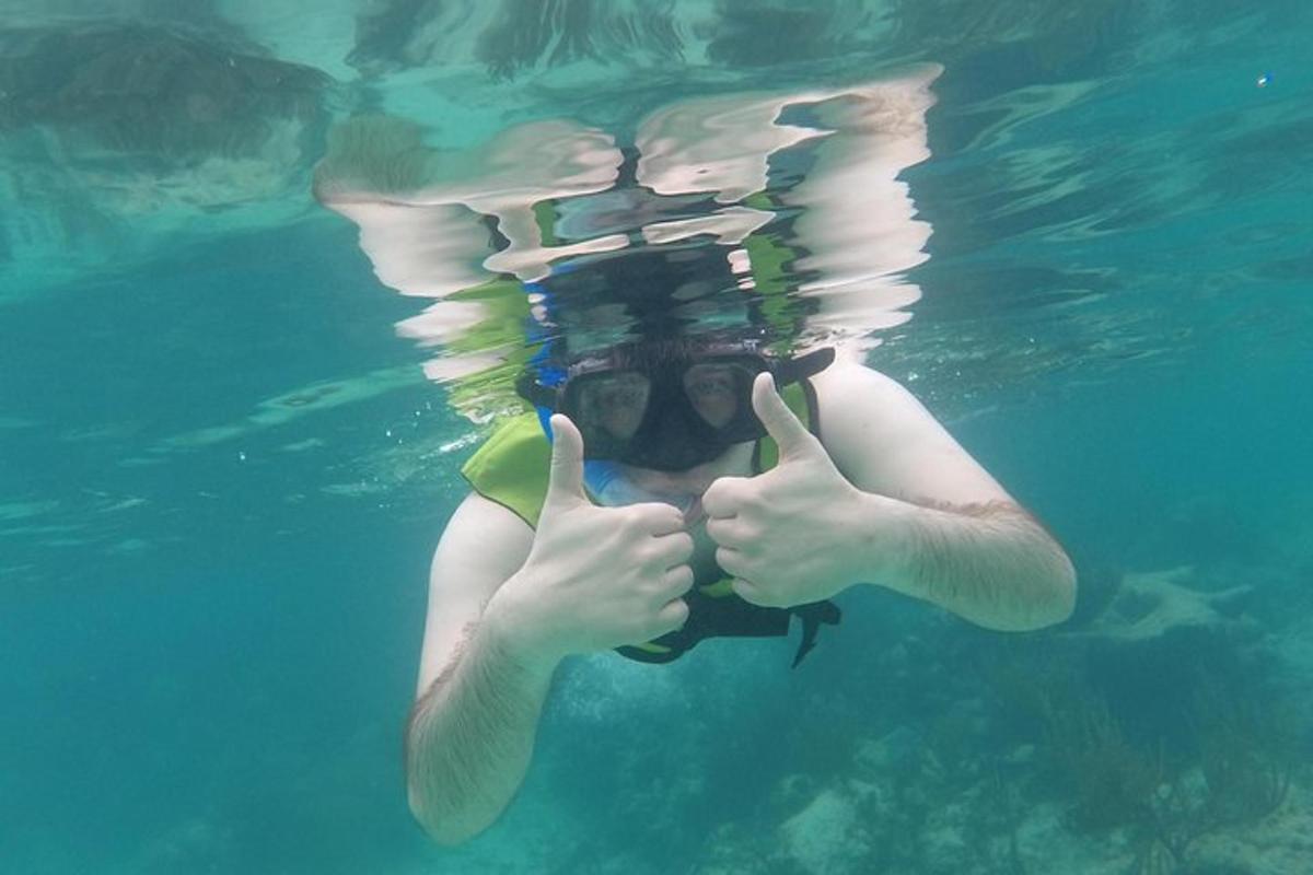 a person in the water giving the thumbs up