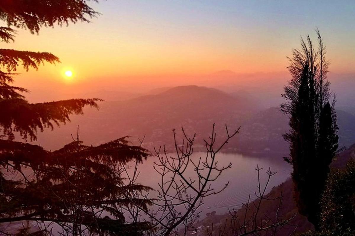 a view of a misty valley at sunset