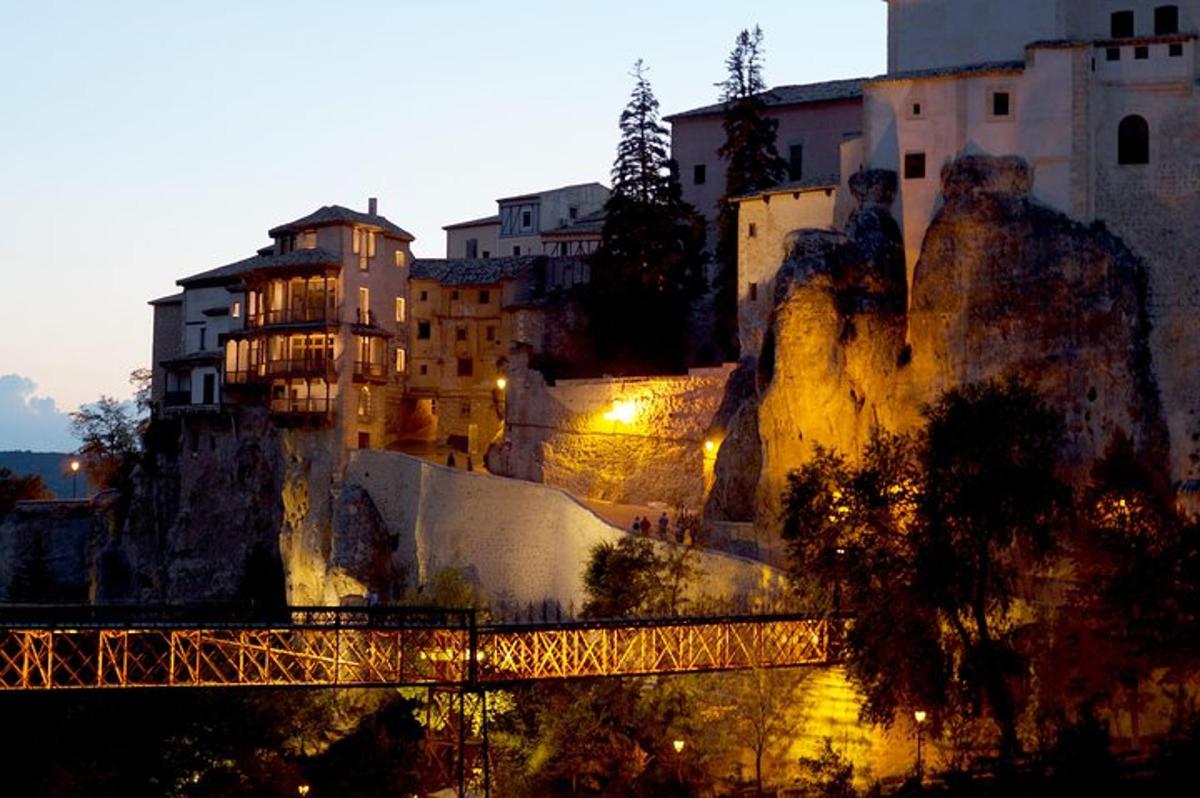 a town on a mountain with a bridge and buildings
