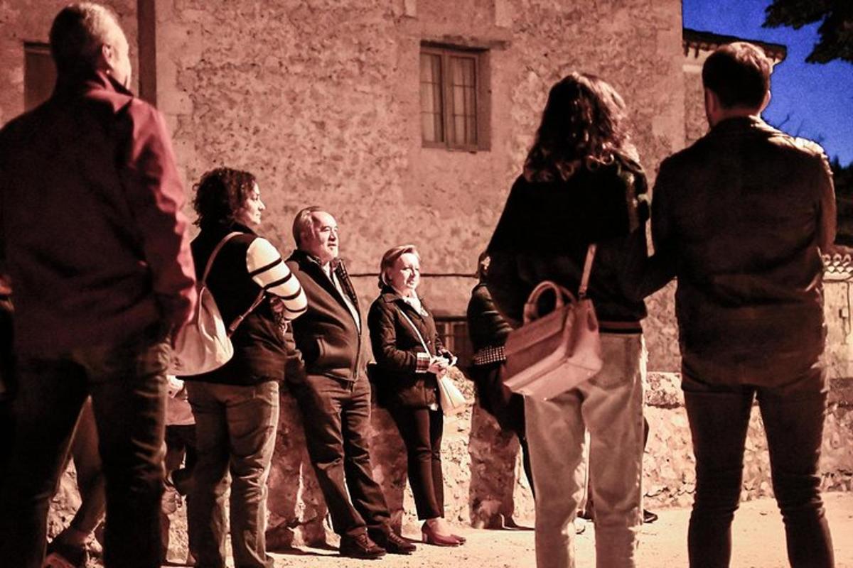 a group of people standing in front of a building