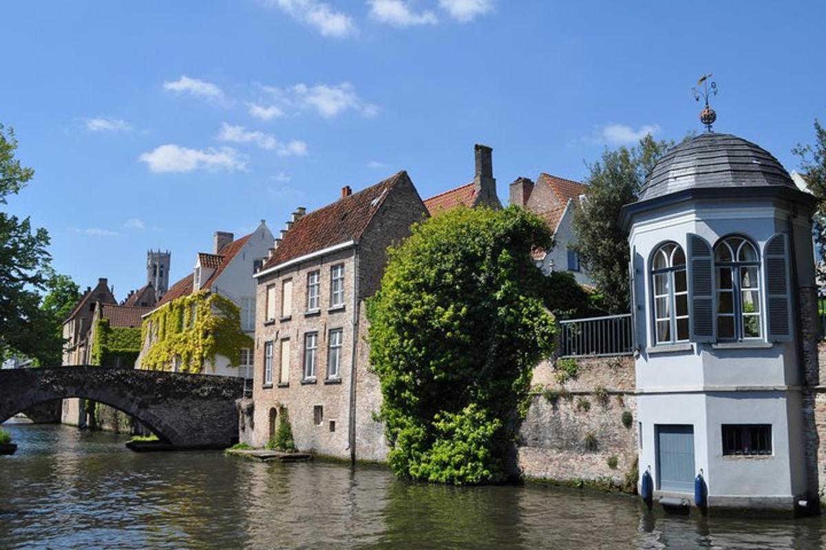 a building in the water next to a bridge