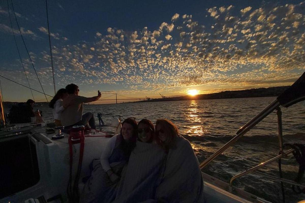 a group of people sitting on a boat in the water