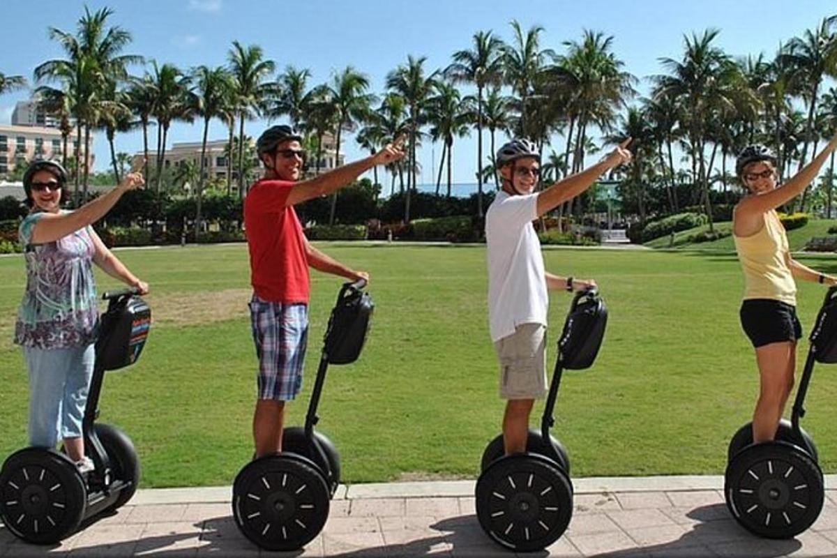 a group of three people riding on segways