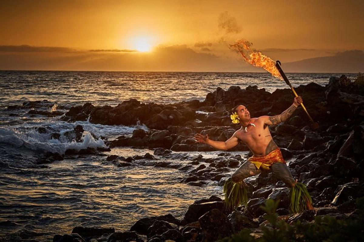 a man standing on the rocks with an umbrella
