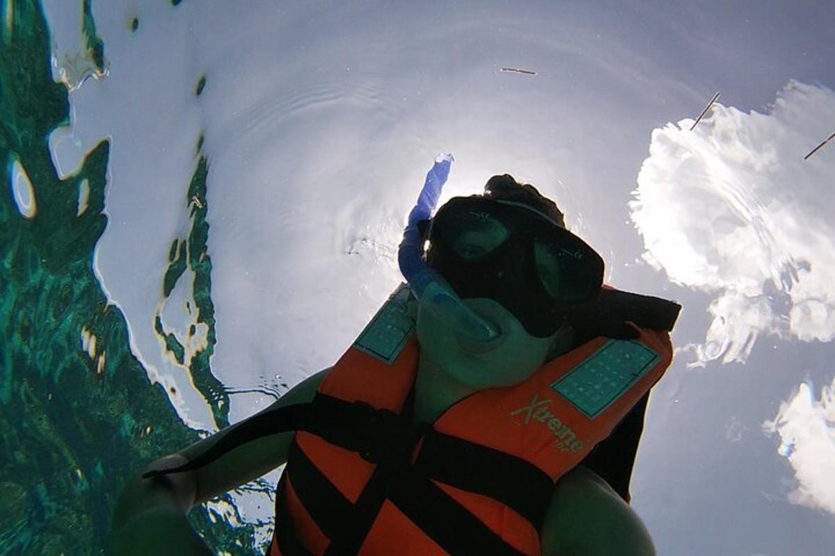 a person in a life vest in the water