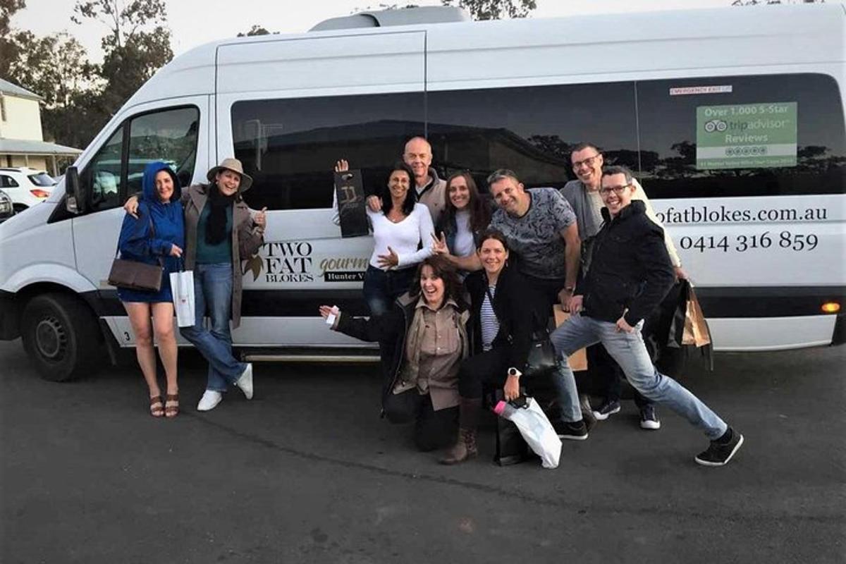 a group of people standing in front of a van