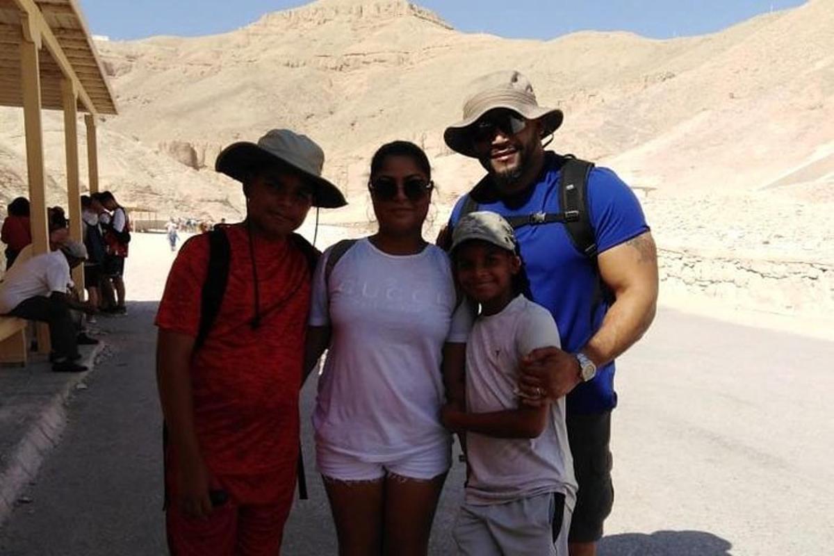 a group of people posing for a picture in the desert