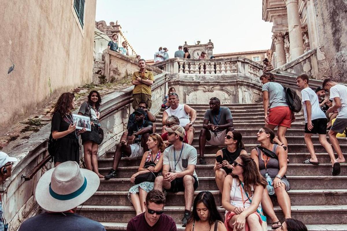 a group of people sitting on the stairs