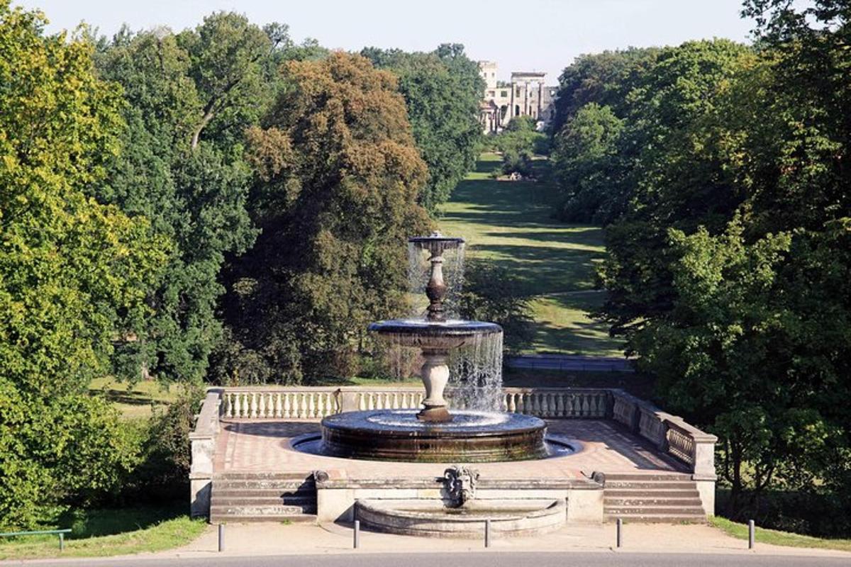 a fountain in the middle of a park
