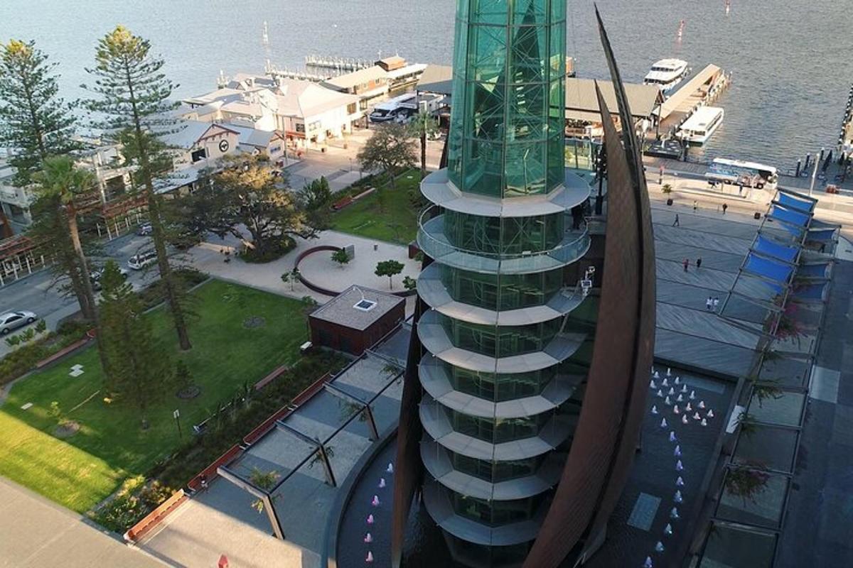 an aerial view of a building next to the water