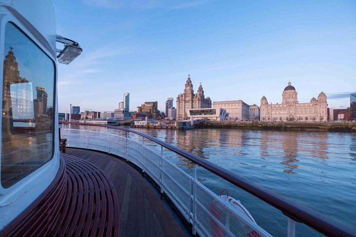 a boat on a river with a view of a city