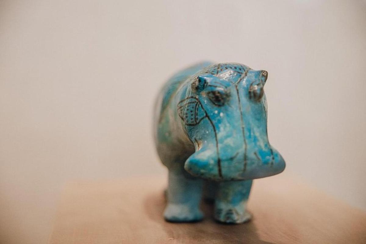 a small figurine of an elephant on a table