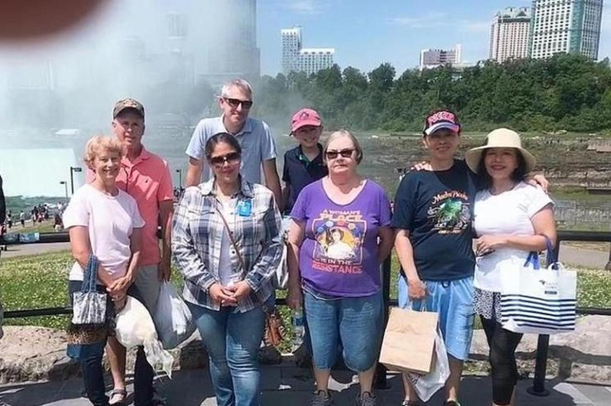 a group of people are posing for a picture