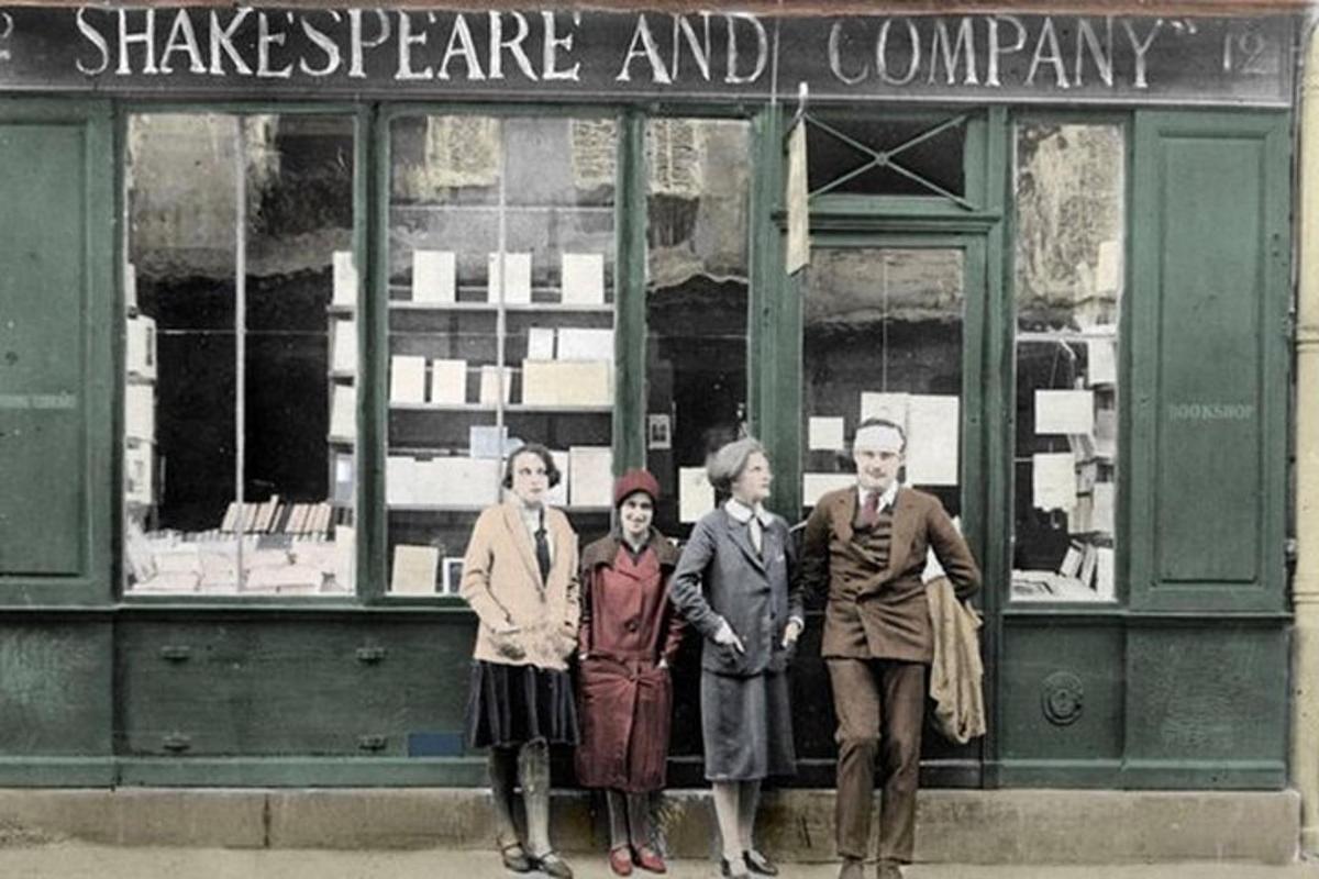 a group of people standing in front of a store