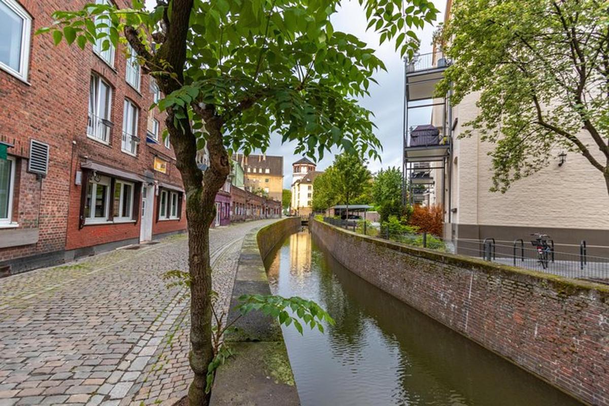 a canal in the middle of a city with buildings