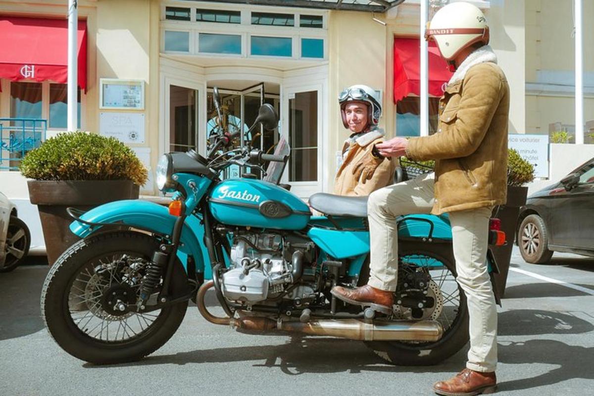 a man is sitting on a blue motorcycle