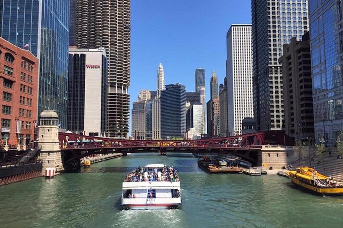 a boat in a river in a city with a bridge